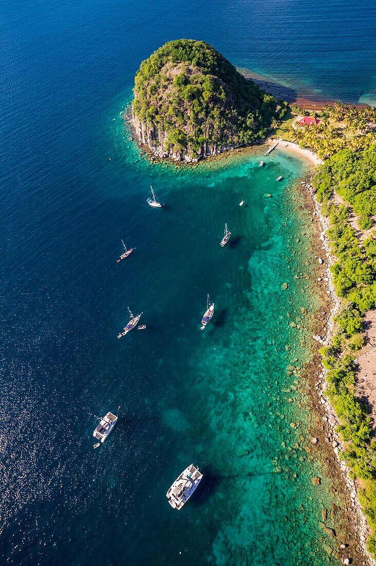 Guadeloupe, Les Saintes, Terre de Haut, the bay of the town of Terre de Haut, listed by UNESCO among the 10 most beautiful bays in the world, here the Pain de Sucre (aerial view)\n