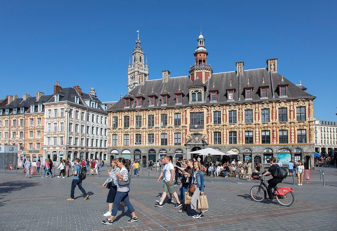 France, Nord, Lille, Place du General De Gaulle or Grand Place, old stock market and belfry of the Chamber of Commerce and Industry in the background\n