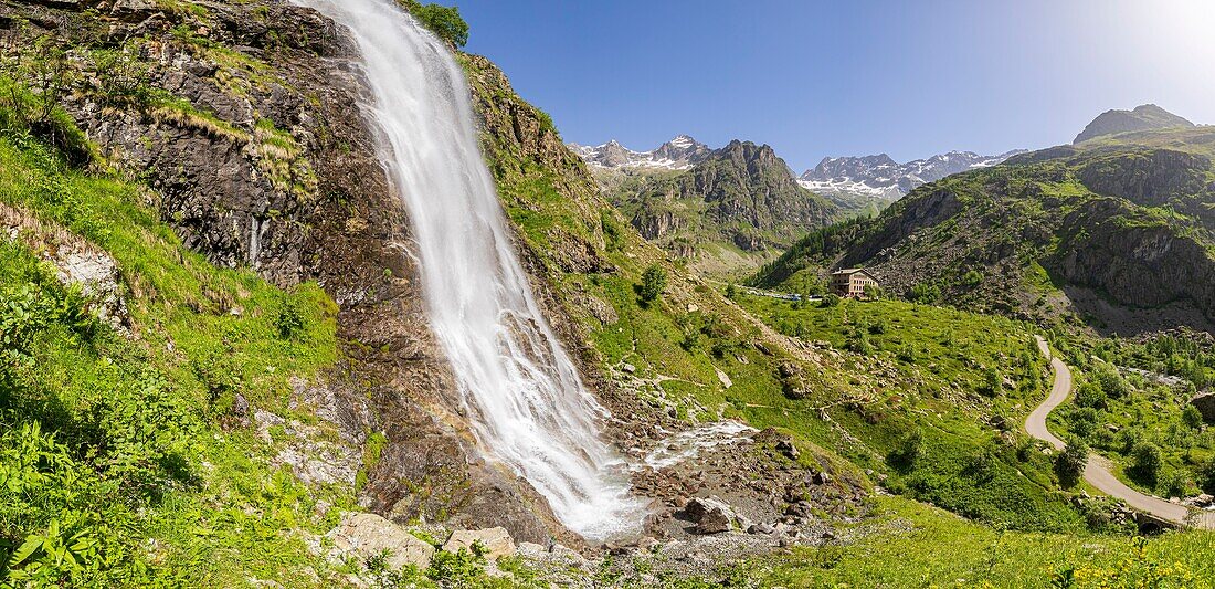 France, Hautes Alpes, Ecrins National Park, valley of Valgaudemar, La Chapelle en Valgaudemar, the Gioberney, the waterfall of the Voile de la Mariée (Bridal Veil) and the Chalet Hotel Gioberney in the background\n