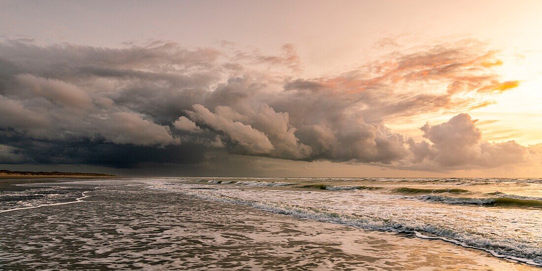 France, Somme, Quend-Plage, a stormy sky settles gradually over the beach at dusk, with special lights\n