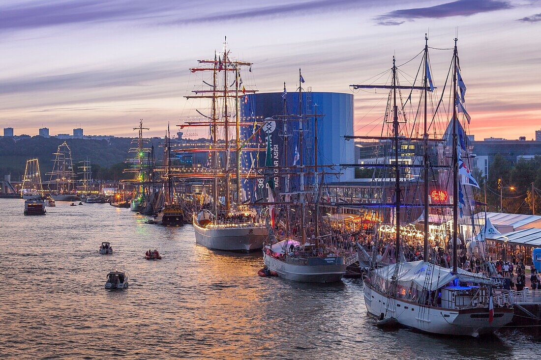 France, Seine Maritime, Rouen, Armada 2019, elevated sunset view on the crowd of visitors and on moored tall ships\n