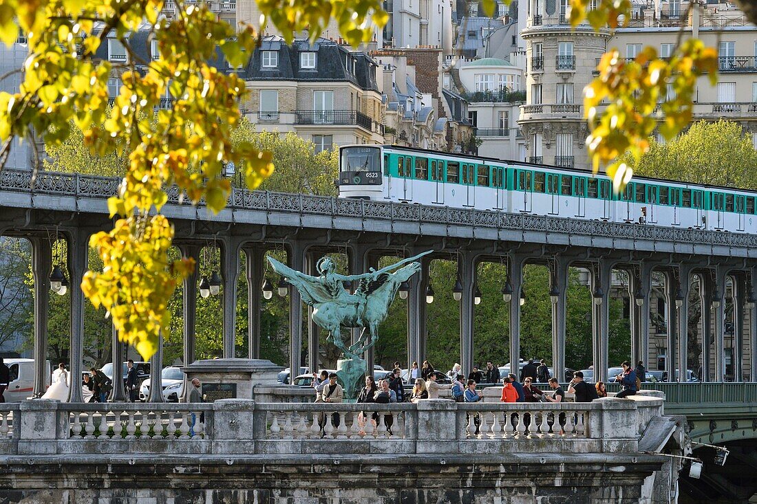France, Paris, area listed as World Heritage by UNESCO, the banks of the Seine river, Bir Hakeim bridge, aerial metro line 6, equestrian statue, symbol of Reviving France by sculptor Wederlink\n