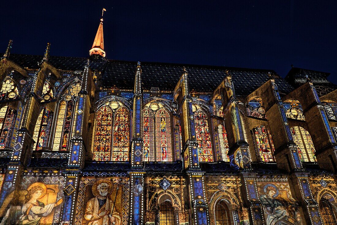 France, Eure et Loir, Chartres, Saint Pierre church illuminated during Chartres en Lumieres, nave, stained glass windows dated 13th and 14th centuries\n