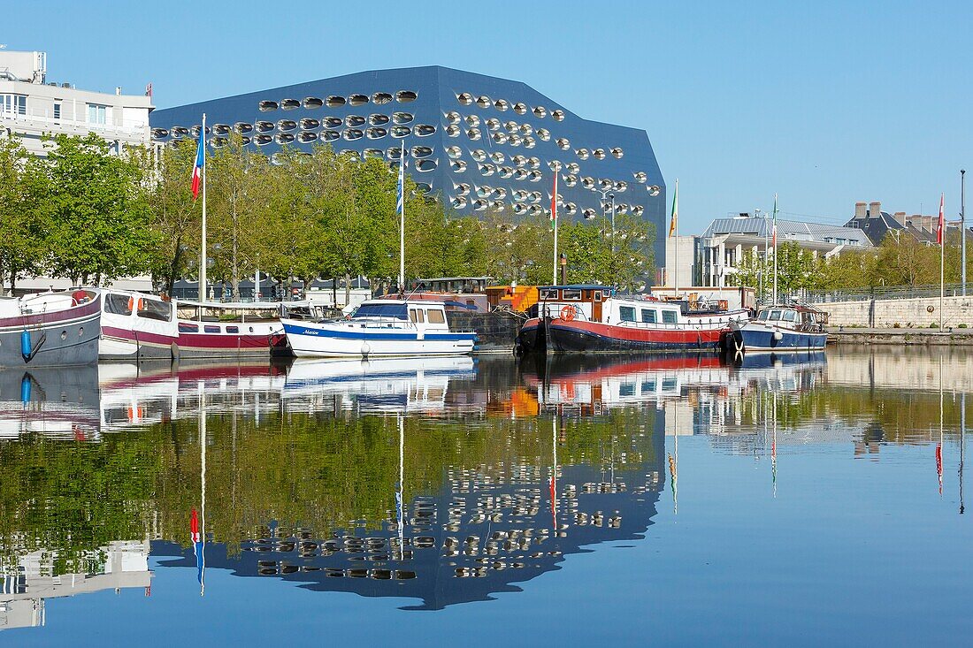 France, Meurthe et Moselle, Nancy, flat boats moored on the Meurthe canal and facade of Pertuy building\n