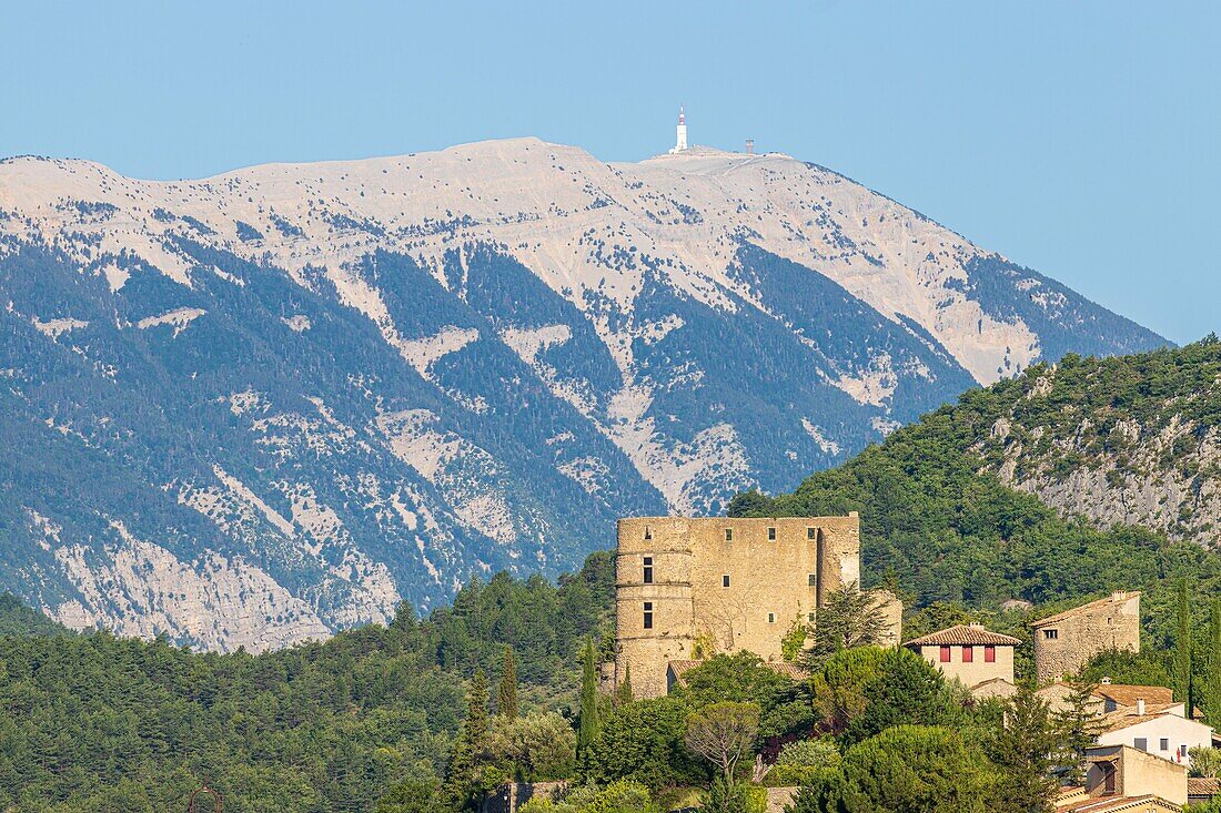 France, Drôme, regional natural park of Baronnies provençales, Montbrun-les-Bains, labeled the Most Beautiful Villages of France, the village and the Renaissance castle of Dupuy-Montbrun, Mont Ventoux in the background\n