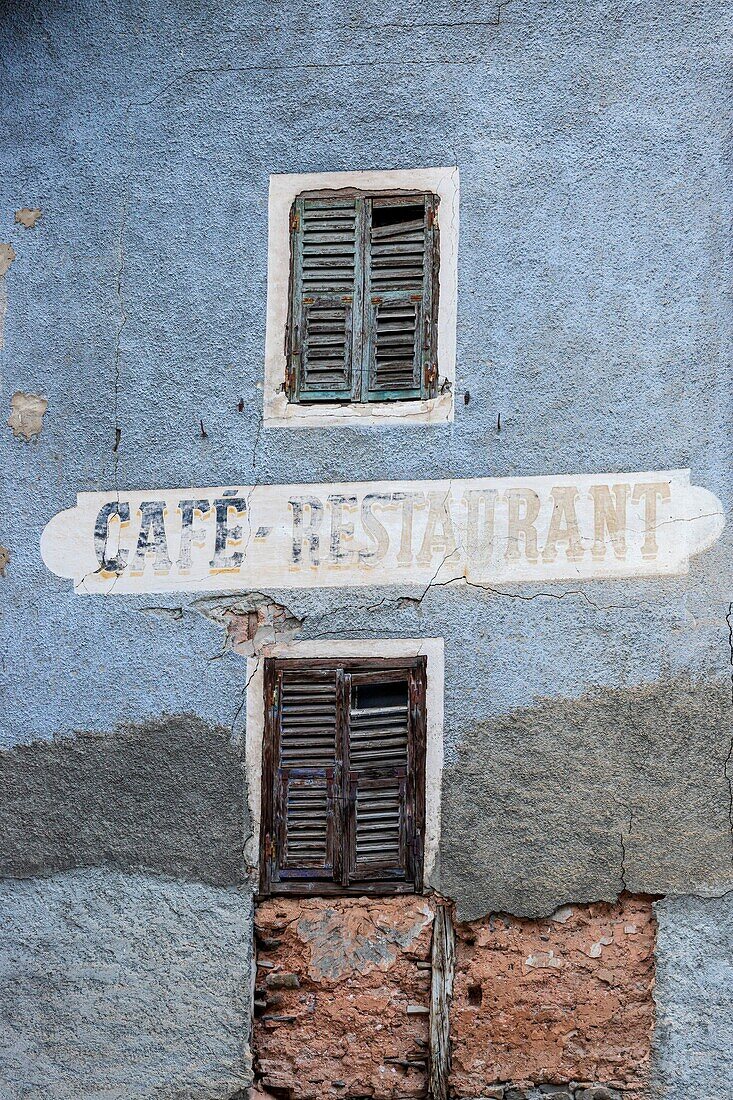 France, Alpes-Maritimes, Mercantour National Park, Tinée valley, Saint-Dalmas-le-Selvage, old cafe sign and restaurant painted on the facade of a village house\n