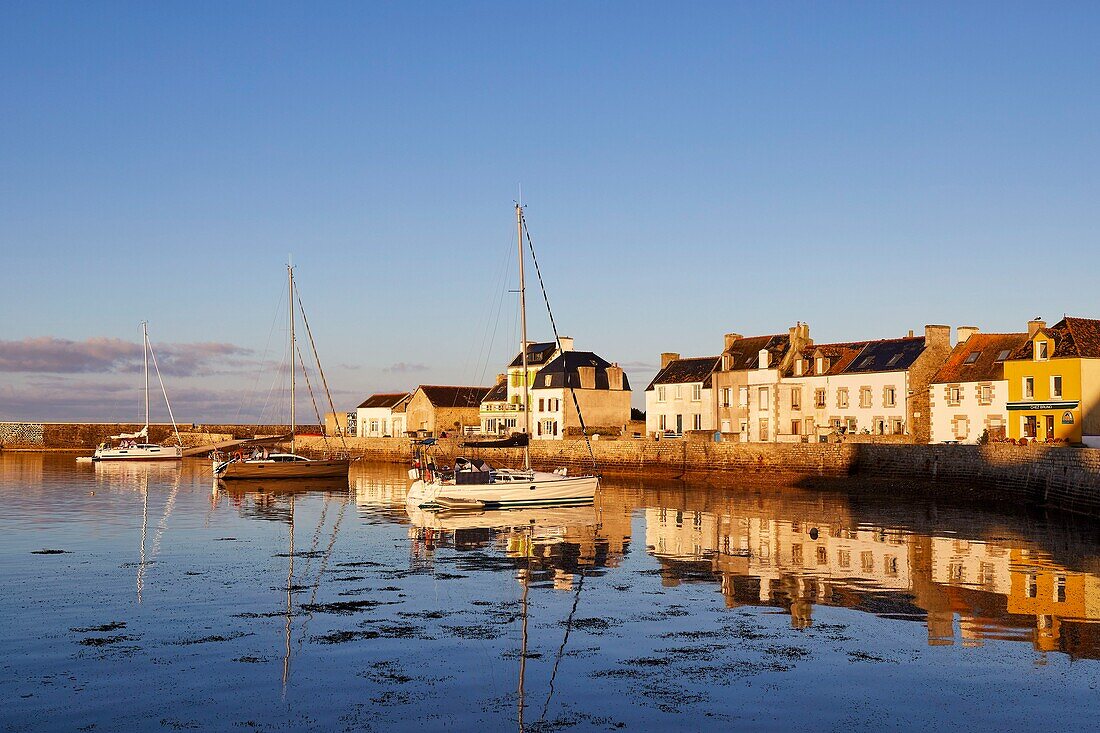 France, Finistere, Iroise Sea, Iles du Ponant, Parc Naturel Regional d'Armorique (Armorica Regional Natural Park), Ile de Sein, labelled Les Plus Beaux de France (The Most Beautiful Village of France), the harbour high tide and the houses on the quay des français libres\n