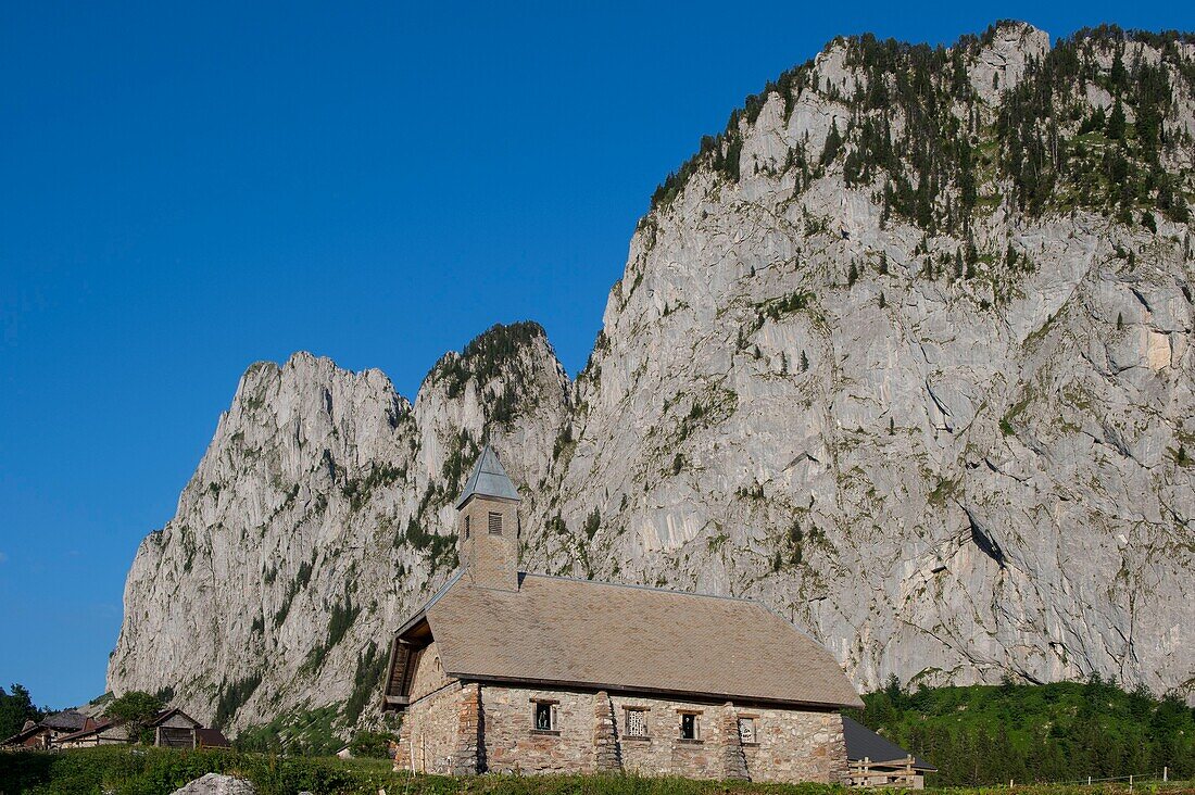 France, Haute Savoie, massif of Chablais, Abondance valley, Abondance, the alp and the hamlet of Ubine at the foot of the cliffs of Mont Chauffe\n