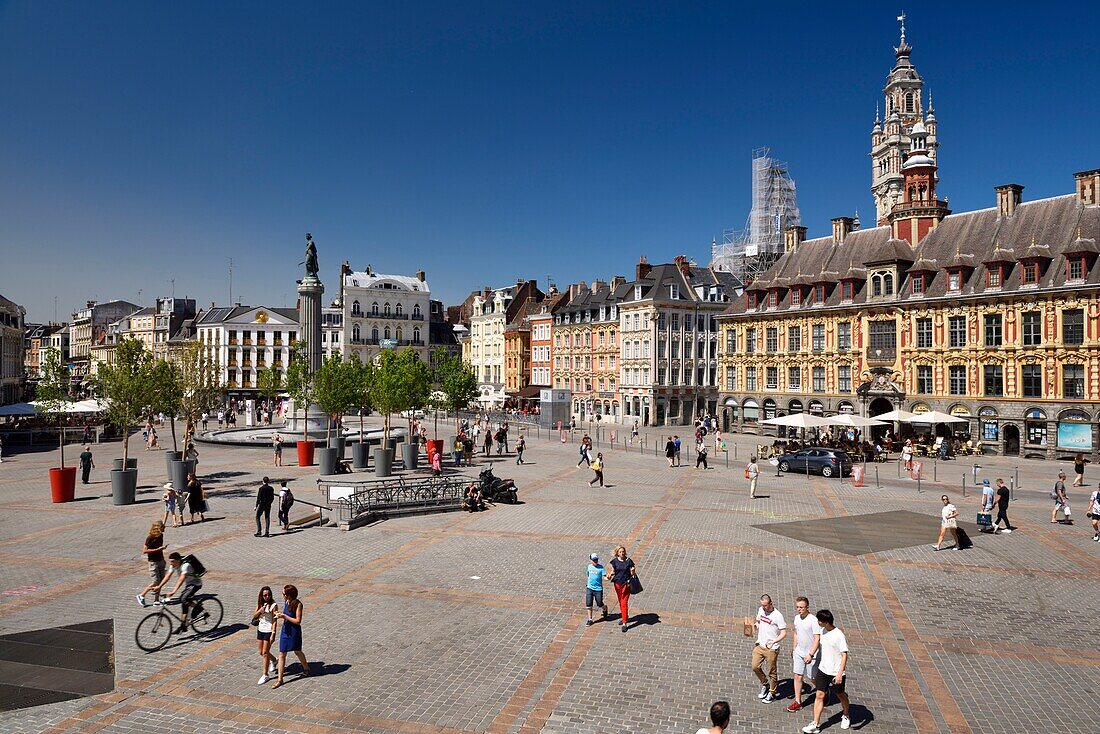 France, Nord, Lille, Place du General De Gaulle or Grand Place, statue of the goddess on its column with the old stock exchange and the belfry of the Chamber of Commerce and Industry\n