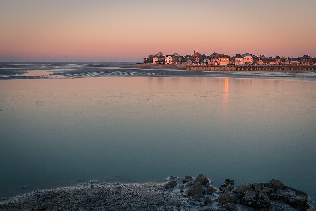 France, Somme, Somme Bay, Le Crotoy, The Somme Bay by cold weather in Winter, view of Le Crotoy in the early morning with frozen water and ice on the ground\n