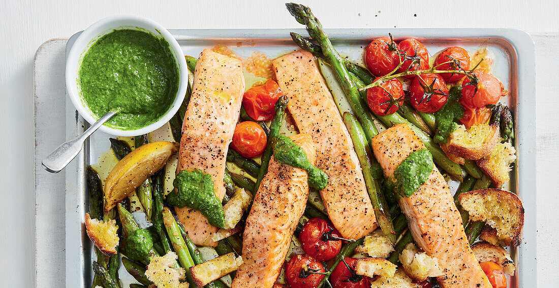 Chimichurri salmon dish with asparagus and tomatoes