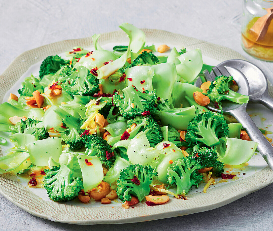 Broccoli salad with salted cashew nuts and chili flakes