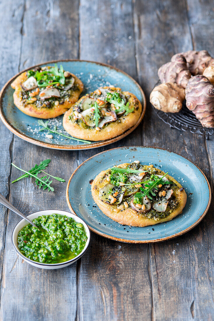 Jerusalem artichoke pizzas with arugula pesto