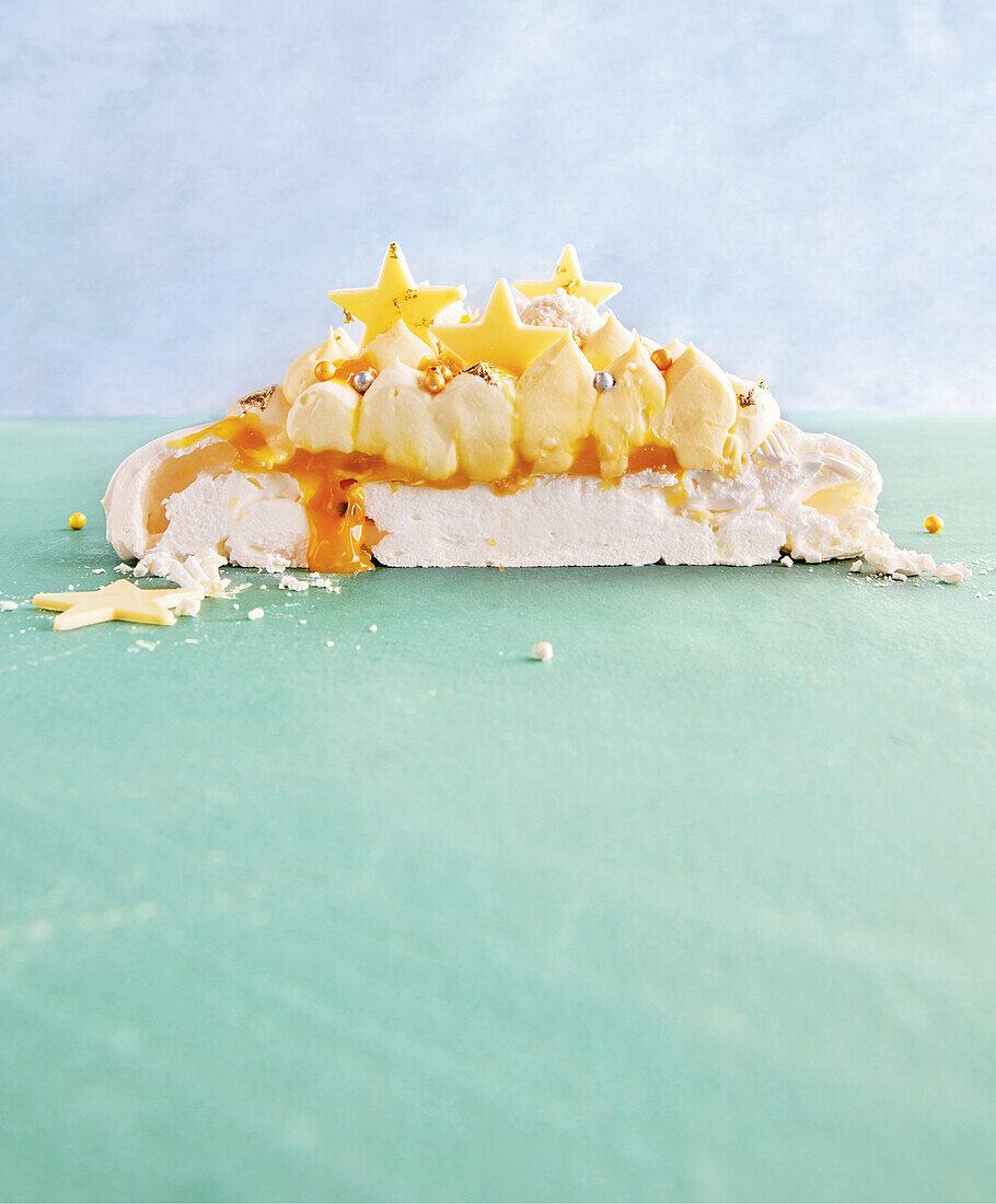 Passion fruit cheesecake pavlova in the shape of a Christmas tree