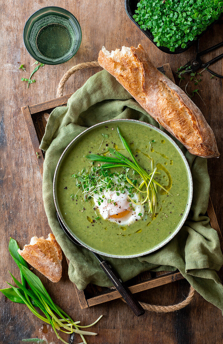 Wild garlic cream soup with poached eggs