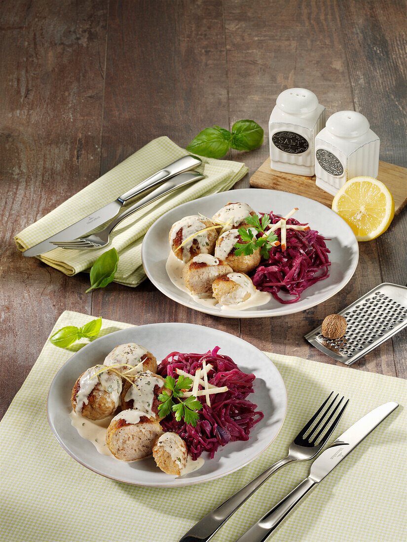 Meatballs with lemon and basil sauce and red cabbage