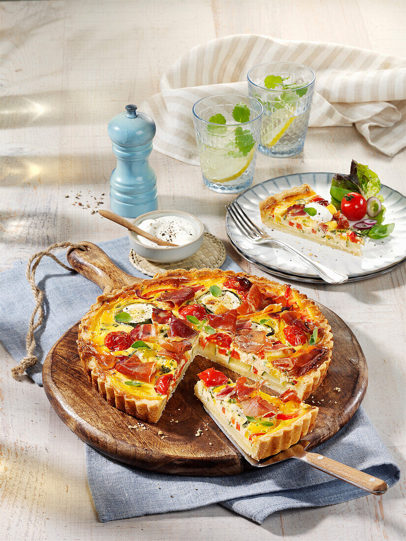 French vegetable quiche with peppers, courgettes and bacon