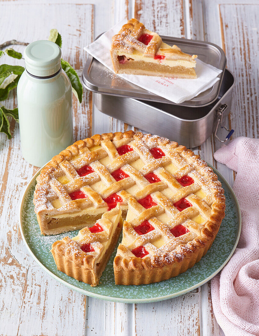 Lattice apple pie with strawberry jam
