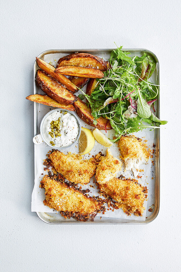 Fish and chips on a baking sheet