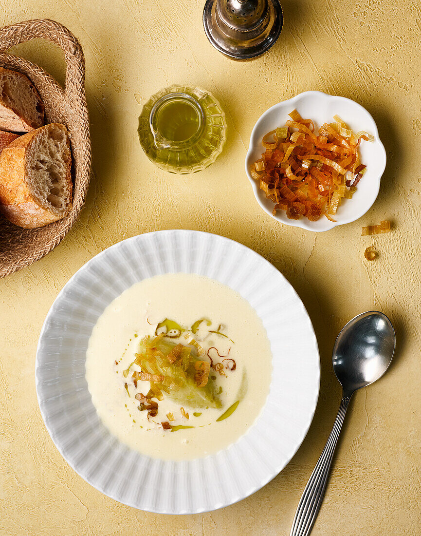 Crème vichyssoise with herb oil and leek