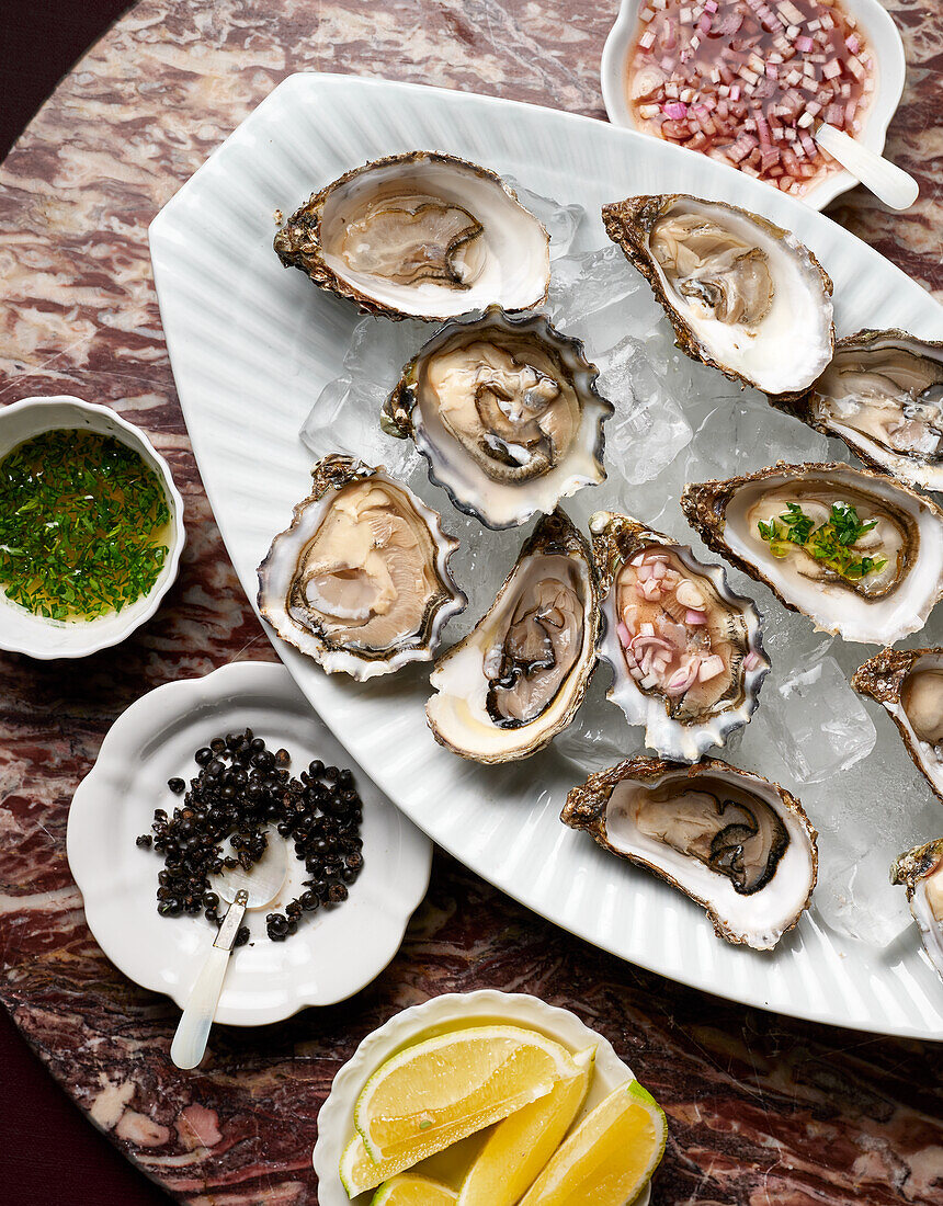 Oyster trio with fermented pepper, tarragon vinaigrette, red wine shallot vinaigrette