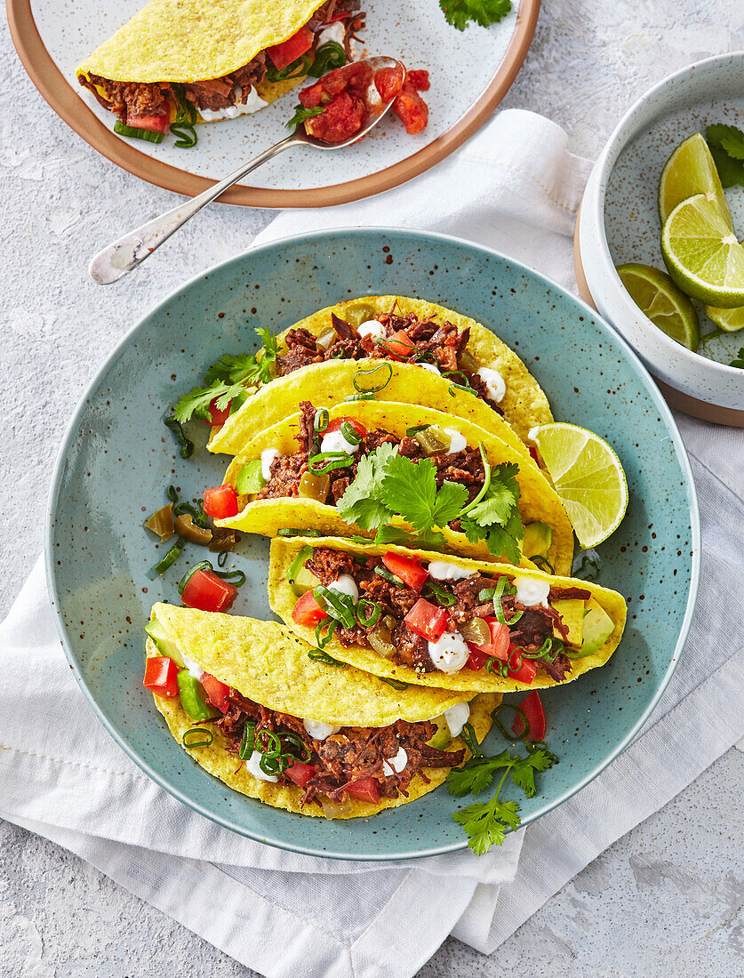 Crispy beef tacos with lime and coriander