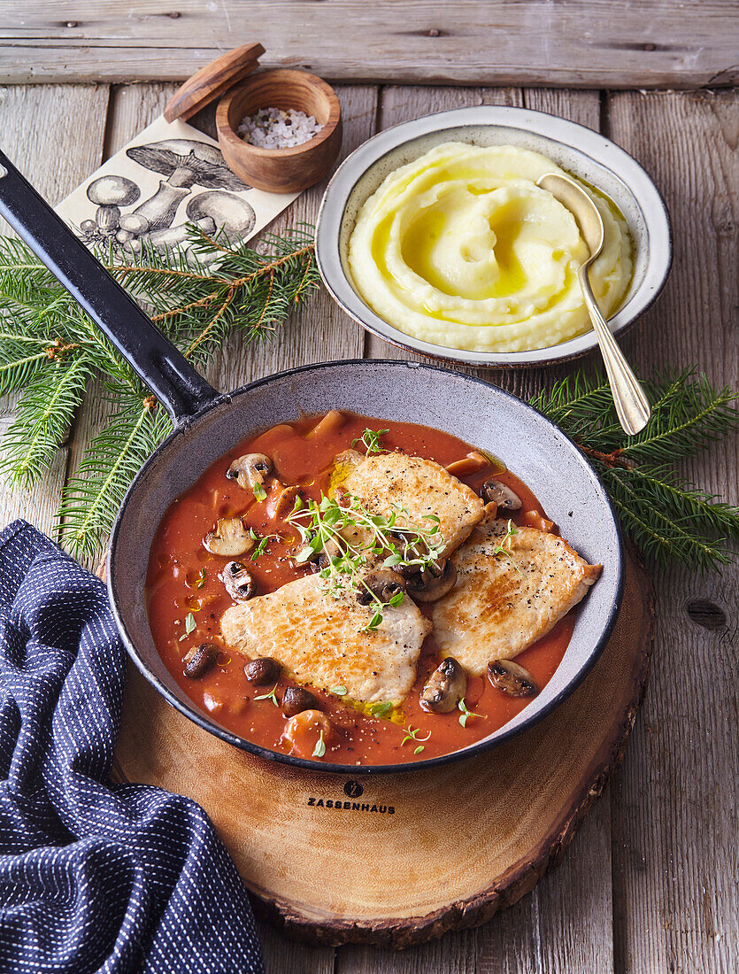 Pork chops with tomato sauce and mushrooms