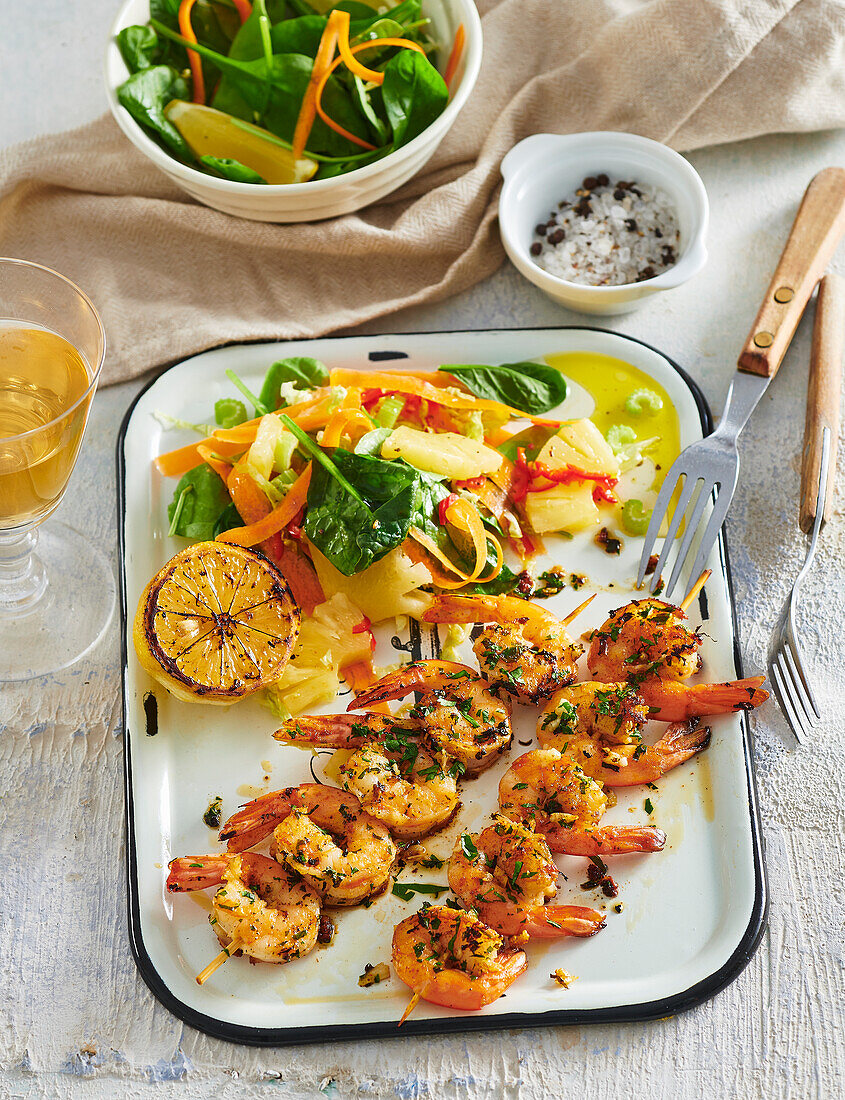 Shrimp skewers with spicy pineapple salad