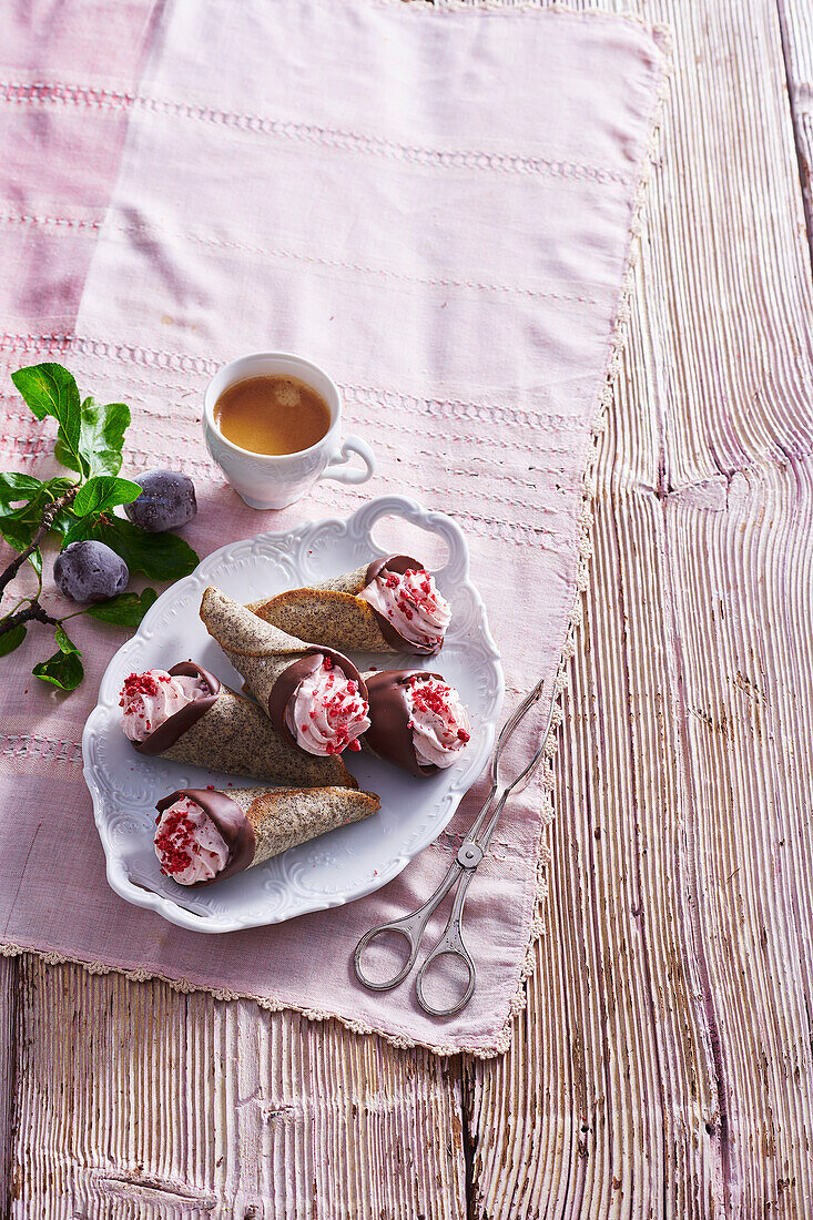 Poppy seed cones with plum cream