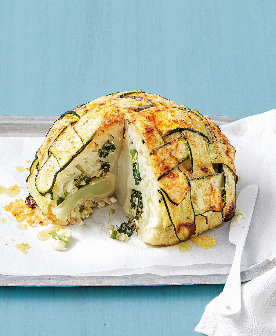 Cauliflower stuffed with cheese and wrapped in zucchini
