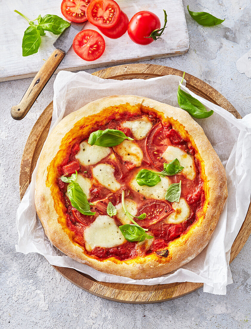 Pizza Margherita with tomatoes, mozzarella and basil