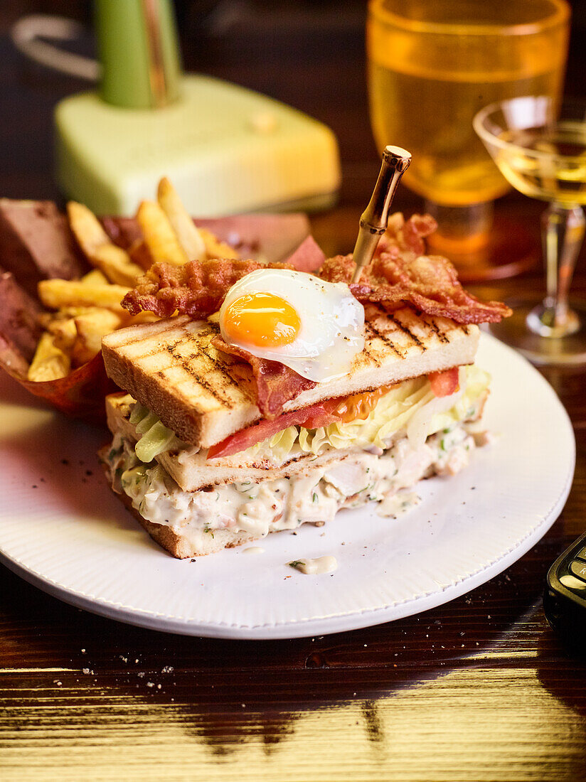 Club sandwich with fried egg