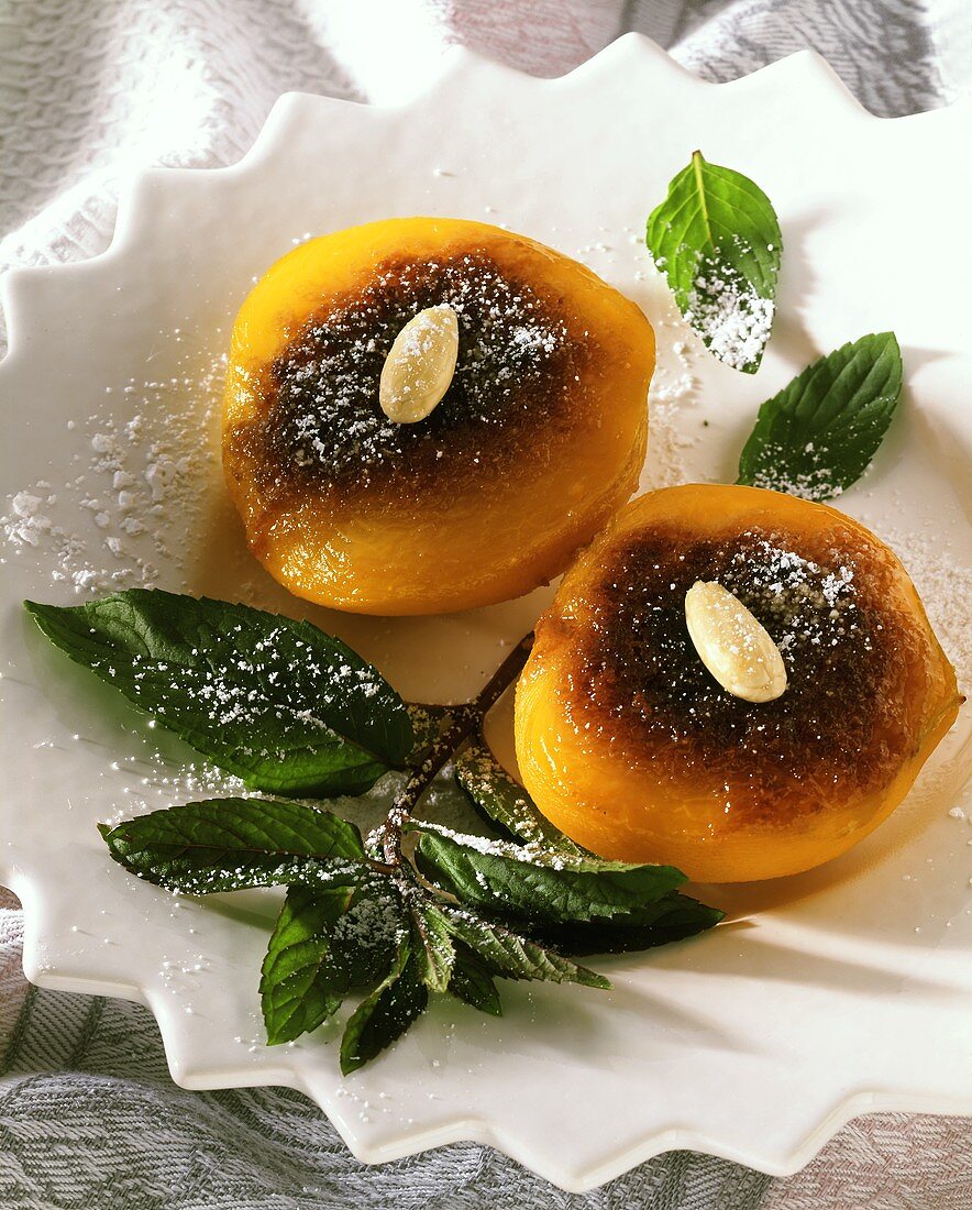 Caramelised apricots, decorated with almonds & a sprig of mint