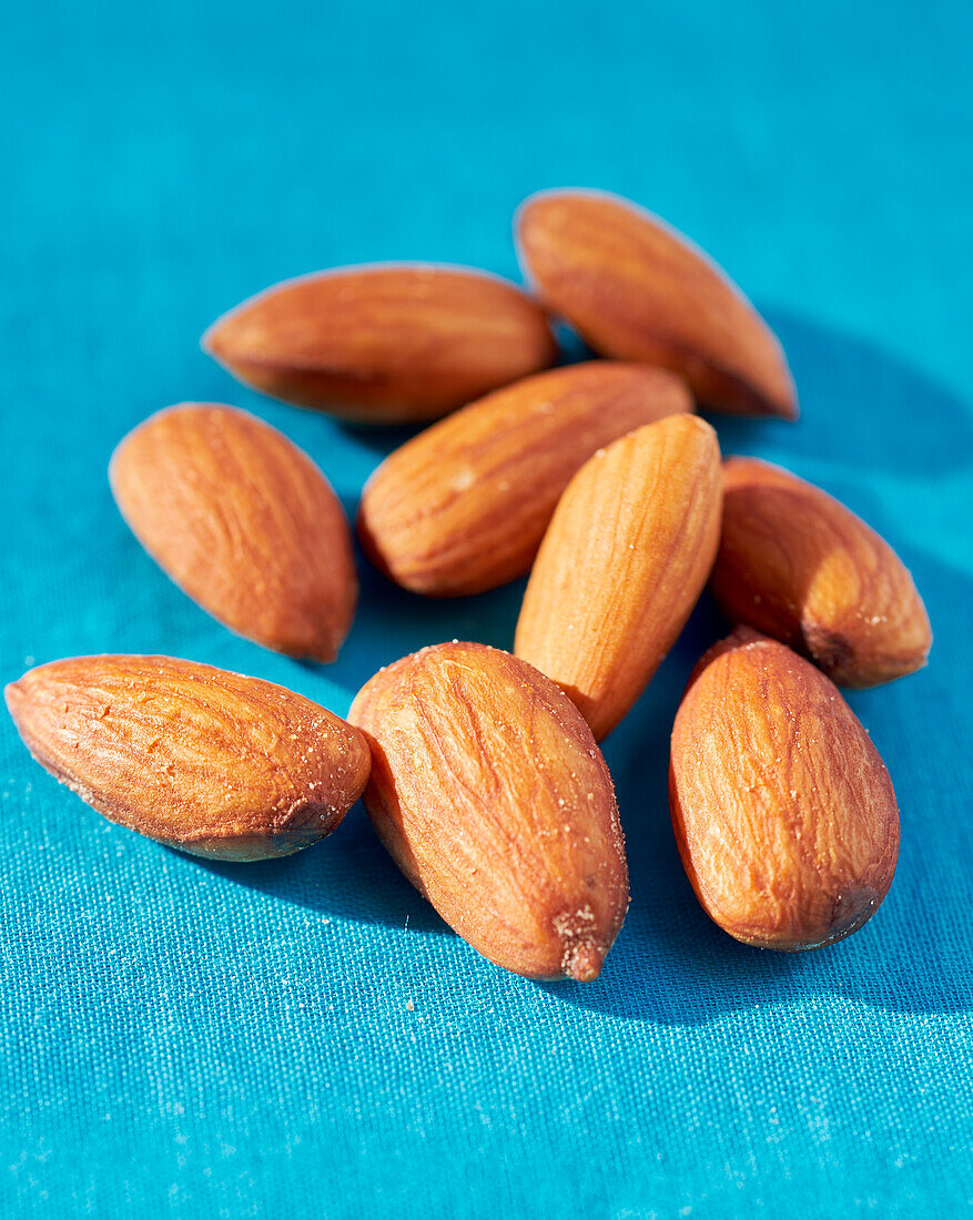 Almonds on a blue background