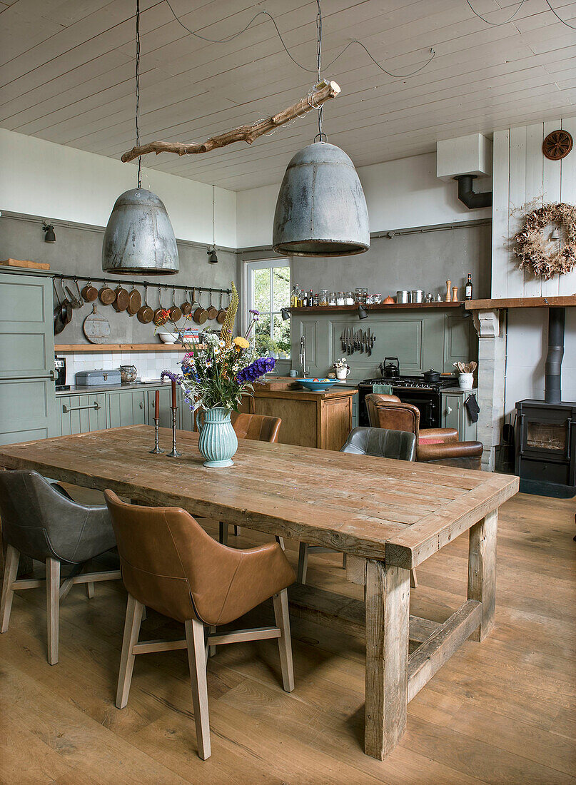 Rustic wooden dining table and leather chairs