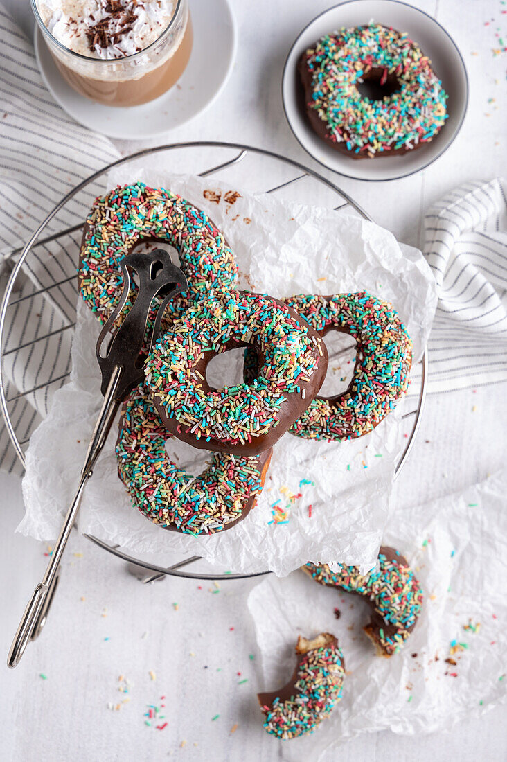 Vegan donuts with dark icing and sugar sprinkles