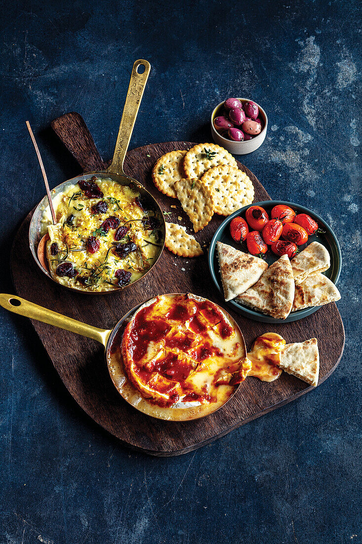 Baked camembert with harissa honey, baked brie with garlic and cranberries