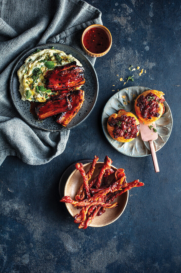 Glazed pancetta with colcannon, puff pastry with bacon and tomato jam and candied bacon spirals