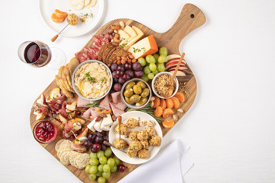Fruit and nut board with cheese, ham and sausage