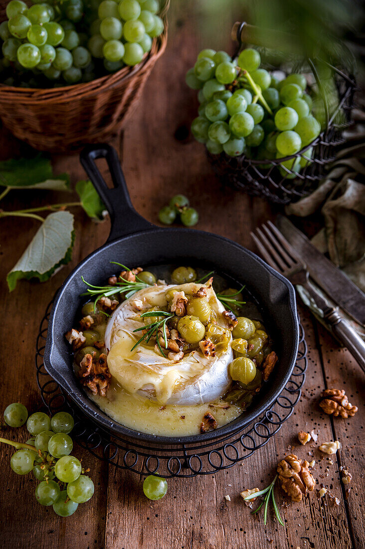 Baked camembert served with grapes