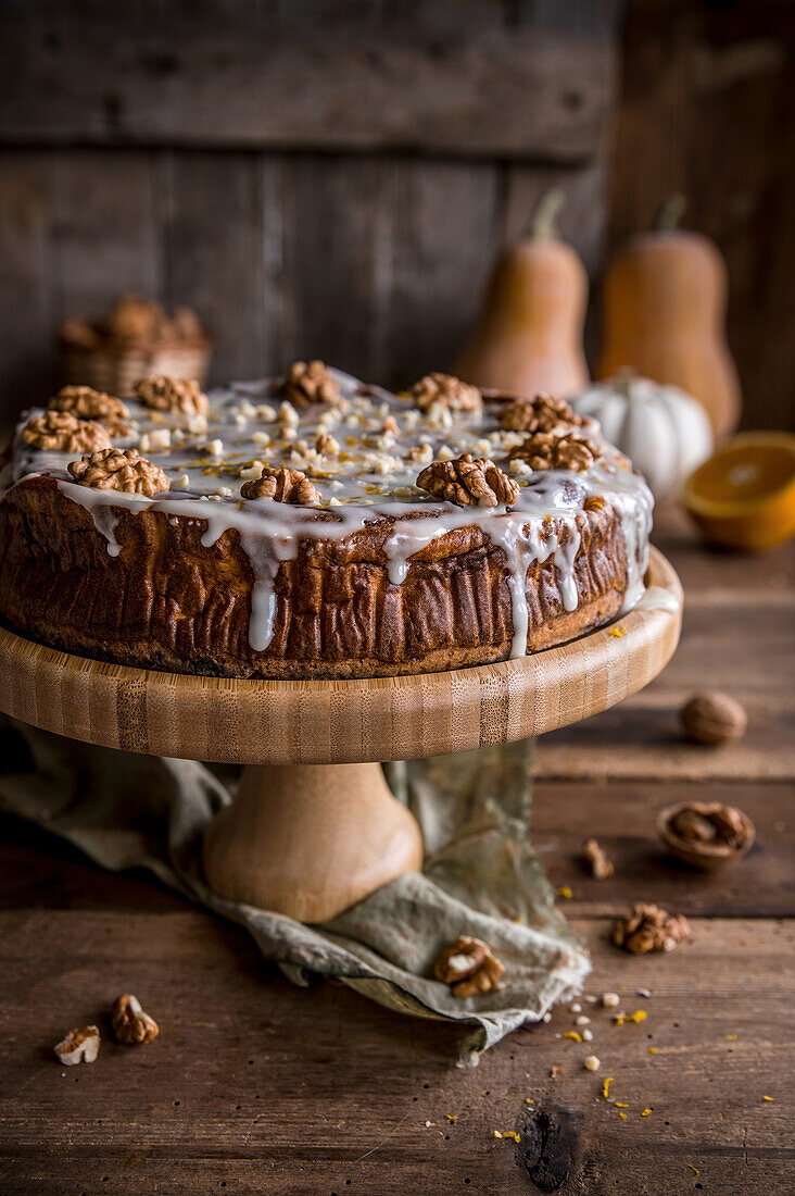 Pumpkin cheesecake with icing and walnuts