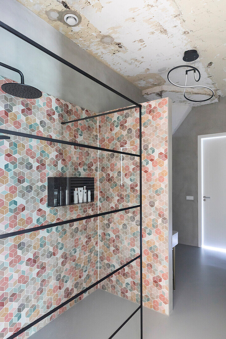 Bathroom with colorful tiled wall and walk-in shower