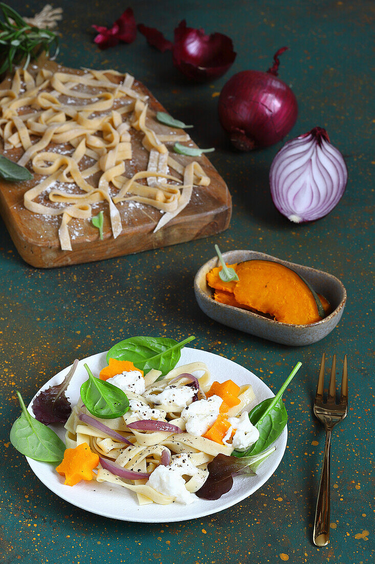 Egg tagliatelle with glazed onions and pumpkin