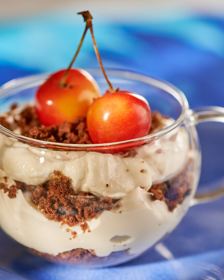 Tiramisu in a glass with cherries