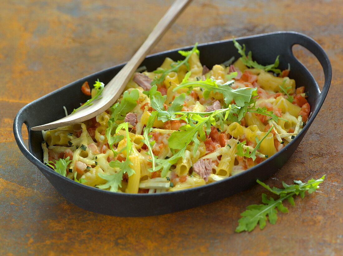 Tuna and pasta casserole with rocket salad