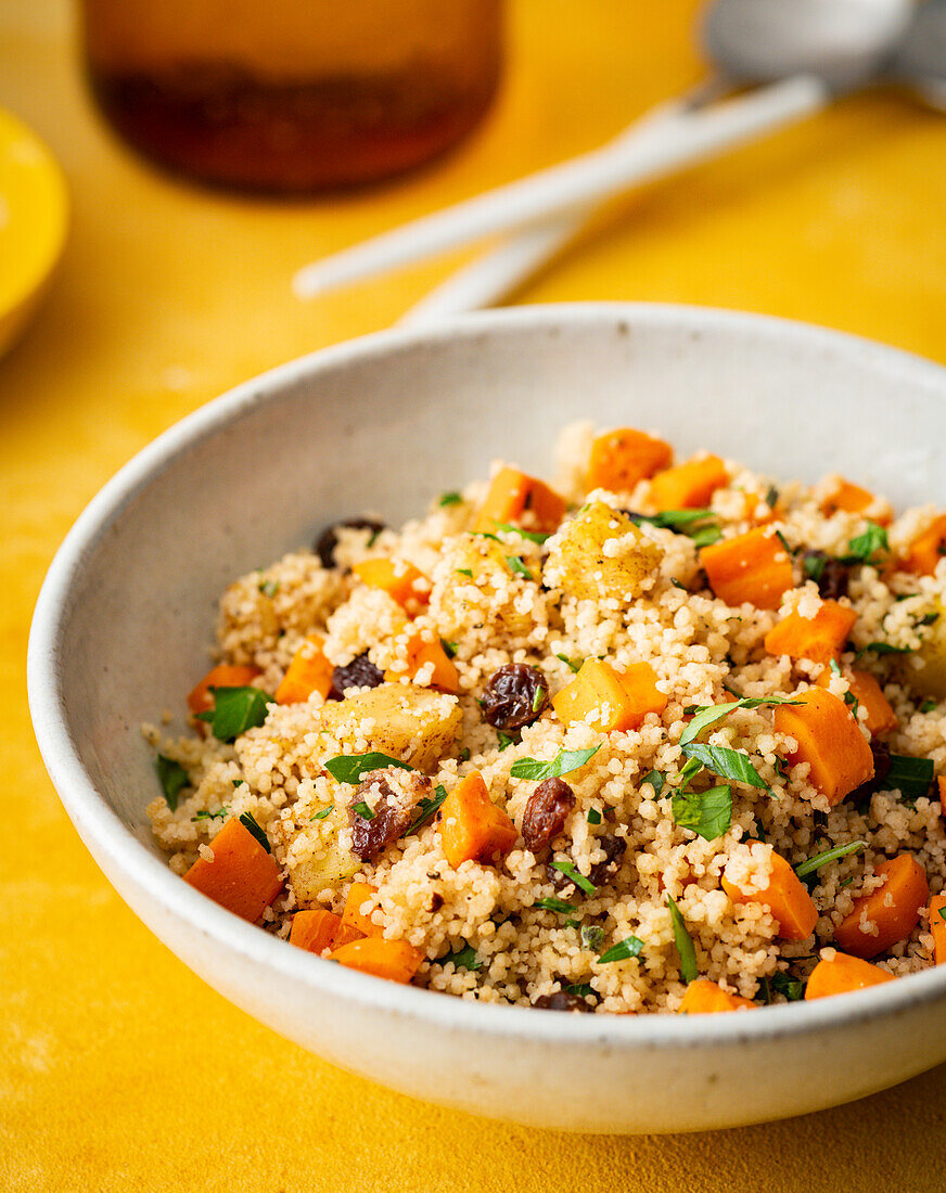 Ayurvedic couscous salad with pumpkin, carrots and raisins