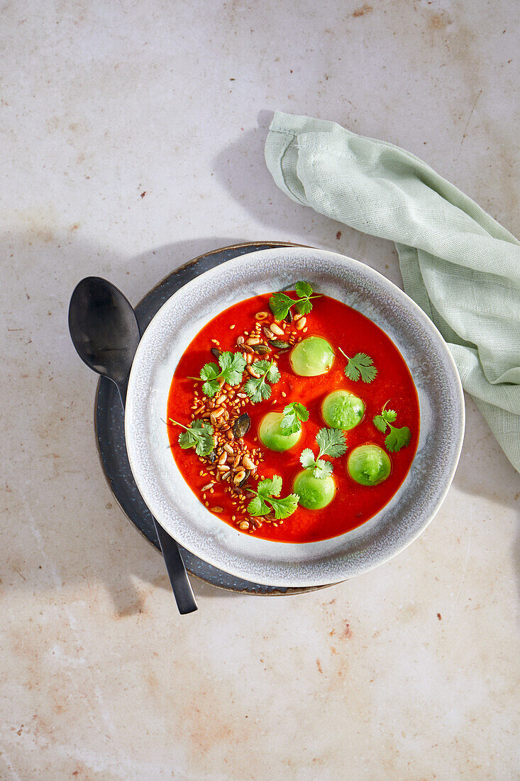 Cream of tomato soup with avocado and chili