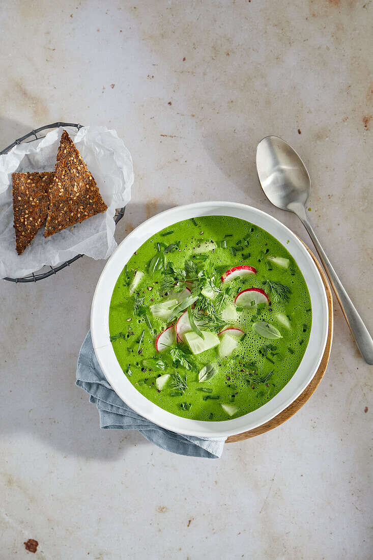 Cold cucumber soup with radishes and herbs
