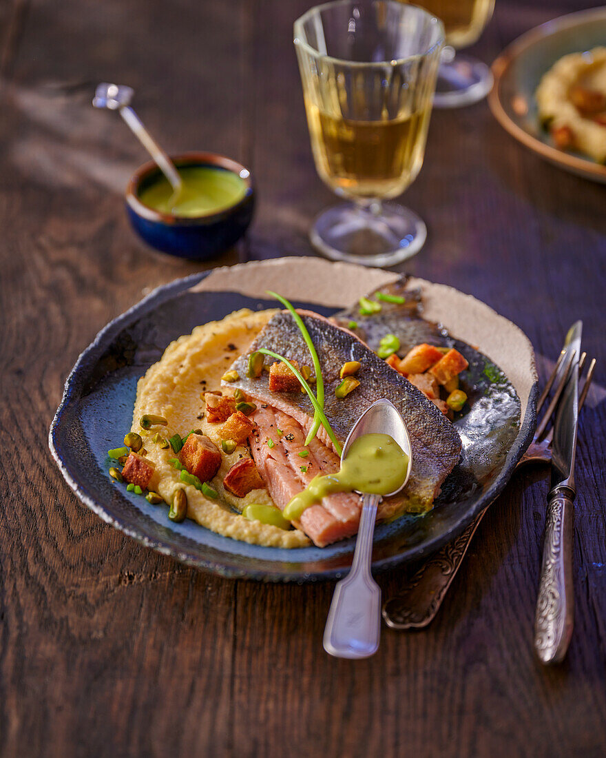 Trout fillet with chartreuse sauce on polenta