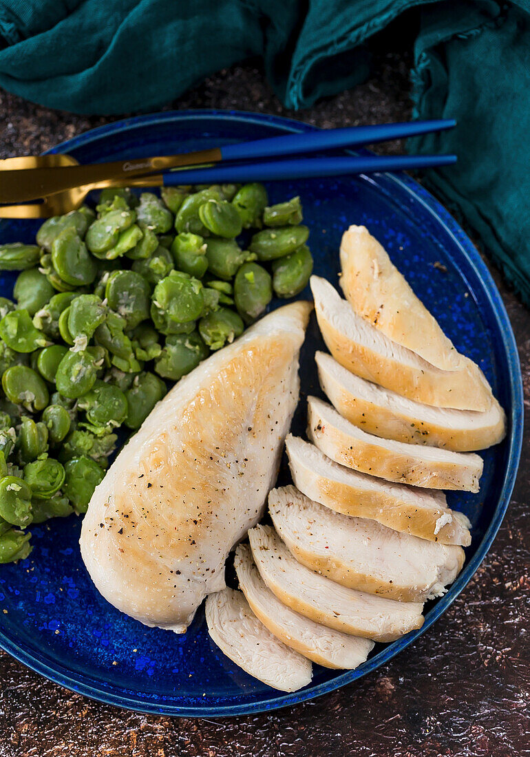 Roasted chicken breast fillet with broad beans